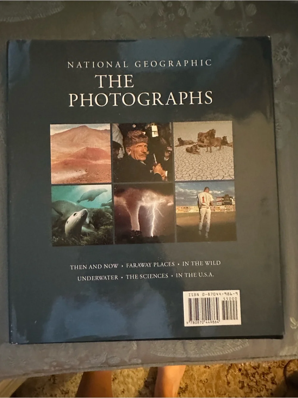 National Geographic Hardcover Book with Red Cover and Brown-Toned Portrait